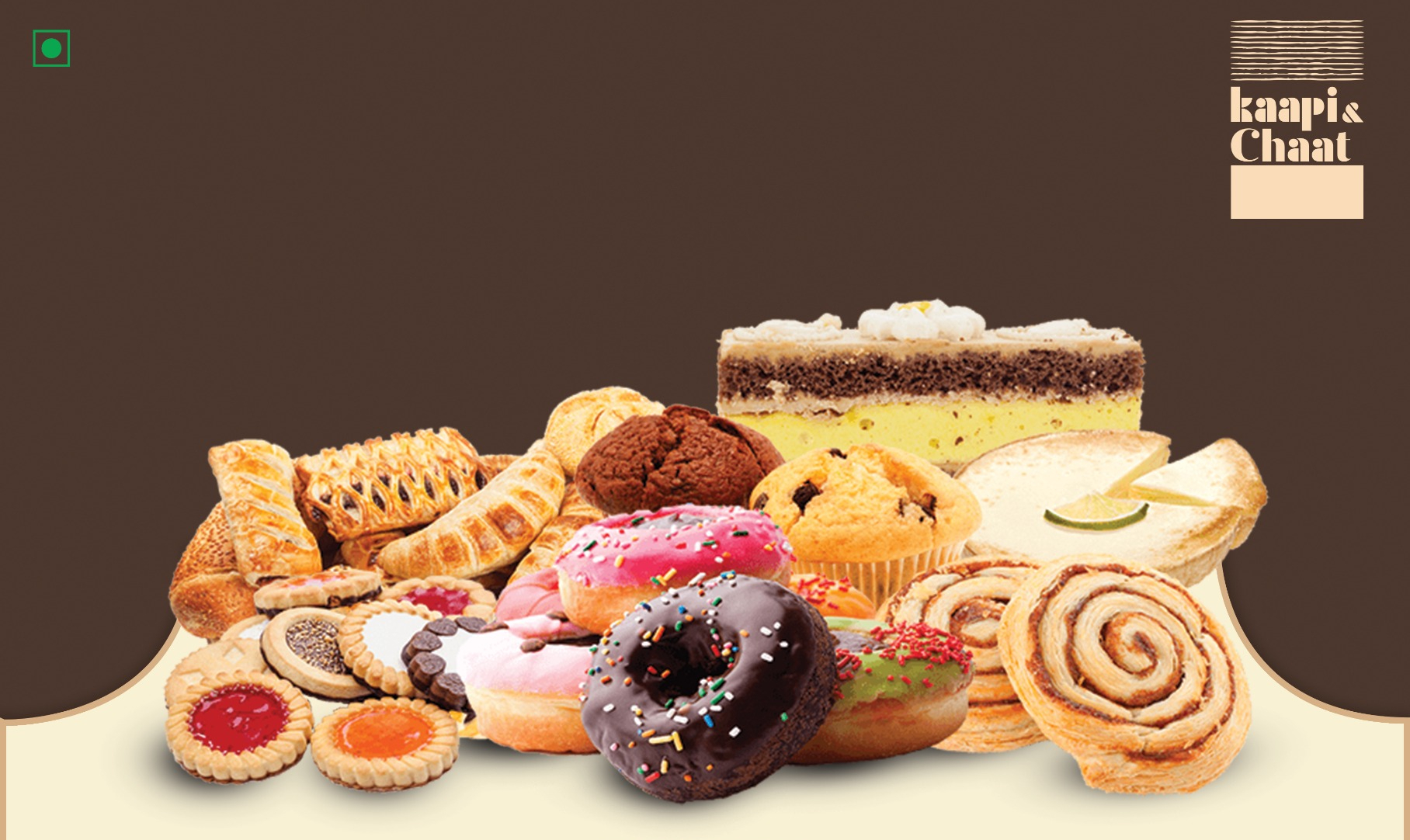 Bakery counter at Kaapi & Karam — veg puffs, brownies, pastries, muffins and cookies
